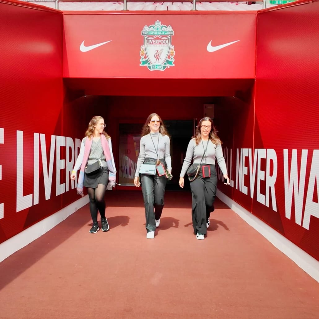 Anfield stadium tour showing the tunnel with group of 3 female friends