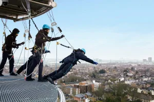 Tottenham fan starting leaning over the Edge on the Dare Skywalk Edge tour at Tottenham Hotspurs FC.